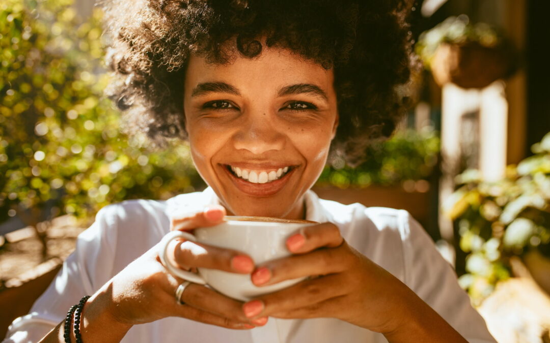 Healthy smiling woman drinking coffee